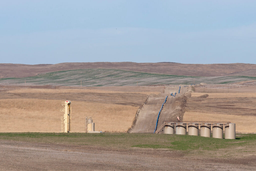 Oil pipeline construction site with storage tanks on the prairie